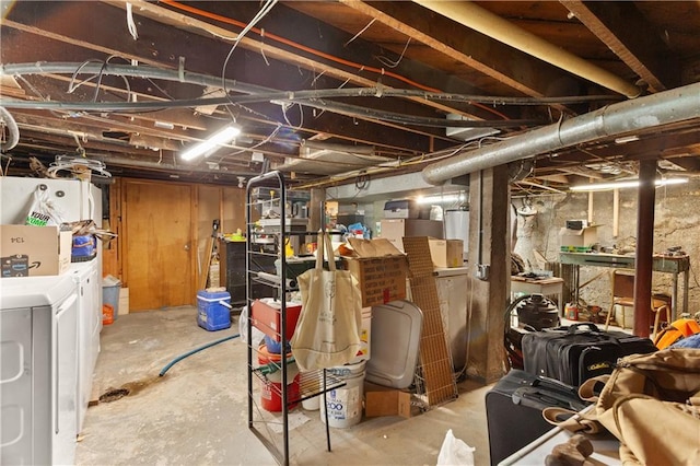 225 W Moore St, Independence, MO 64050 - unfinished basement featuring washer and clothes dryer and fridge