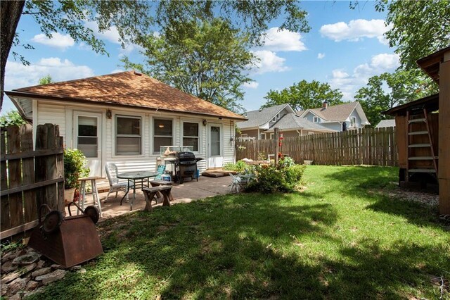 225 W Moore St, Independence, MO 64050 - fenced backyard featuring a patio area
