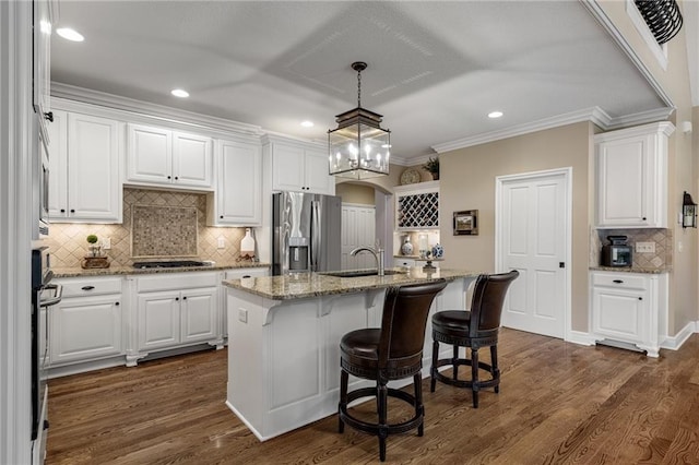 14208 Larsen St, Overland Park, KS 66221 - kitchen with stainless steel fridge, white cabinetry, cooktop, decorative backsplash, and dark wood finished floors