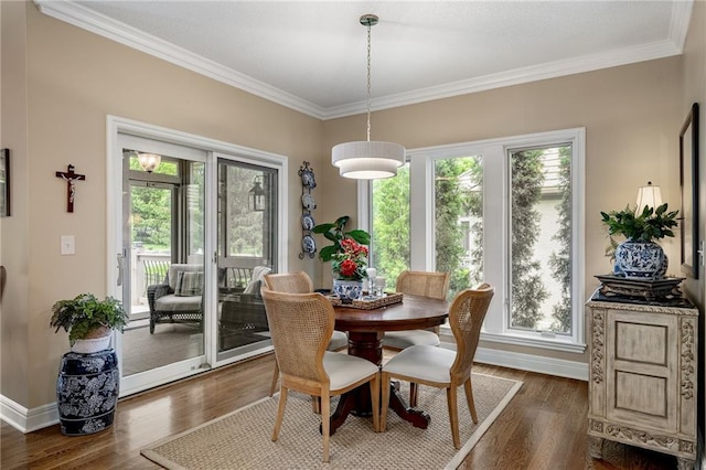 14208 Larsen St, Overland Park, KS 66221 - dining area with crown molding, plenty of natural light, and dark wood-style floors