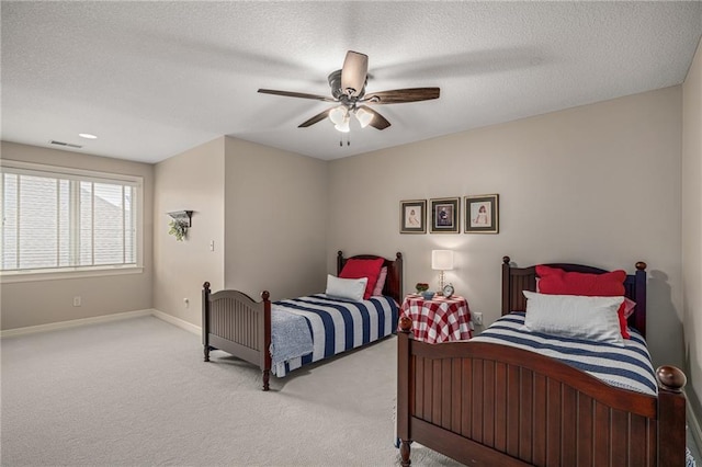 14208 Larsen St, Overland Park, KS 66221 - bedroom featuring light colored carpet, a textured ceiling, and a ceiling fan