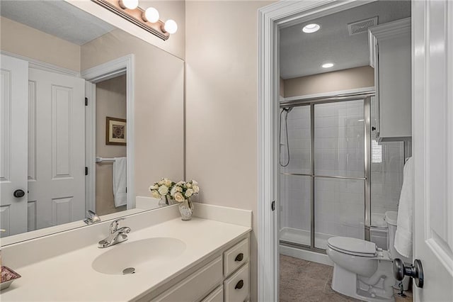 14208 Larsen St, Overland Park, KS 66221 - bathroom with vanity, a stall shower, and recessed lighting