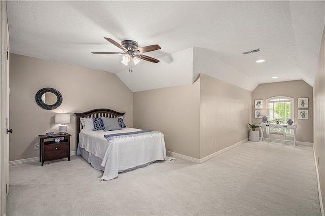 14208 Larsen St, Overland Park, KS 66221 - bedroom featuring vaulted ceiling, light carpet, ceiling fan, an office area, and a textured ceiling