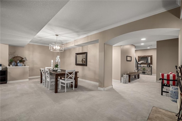 14208 Larsen St, Overland Park, KS 66221 - dining room with carpet flooring, arched walkways, ornamental molding, a chandelier, and a textured ceiling