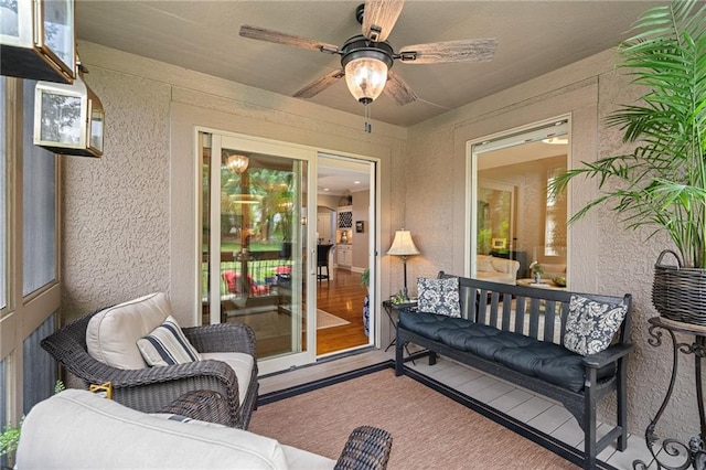 14208 Larsen St, Overland Park, KS 66221 - living room with ceiling fan, a textured wall, and wood finished floors