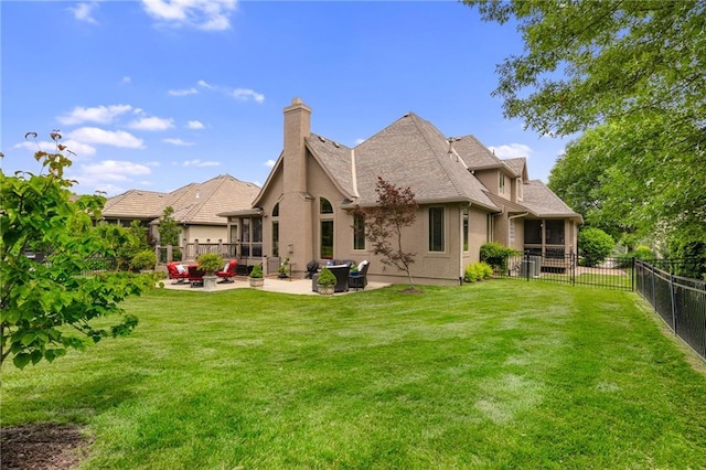 14208 Larsen St, Overland Park, KS 66221 - back of house with a patio, a fenced backyard, stucco siding, a chimney, and an outdoor living space