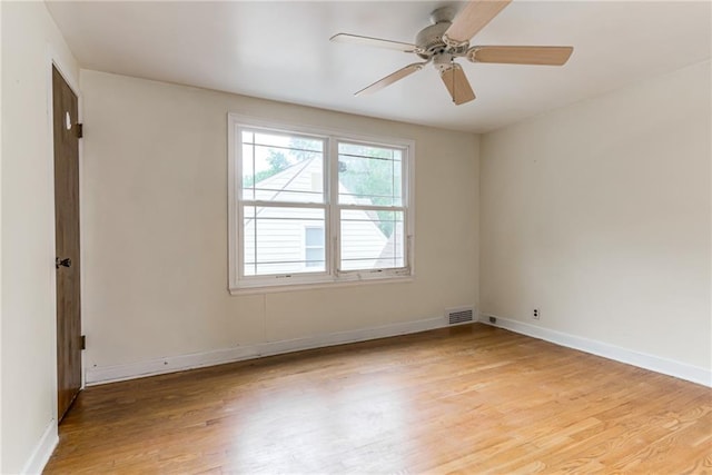 6645 Cherry St, Kansas City, MO 64131 - empty room with light wood-style floors and ceiling fan