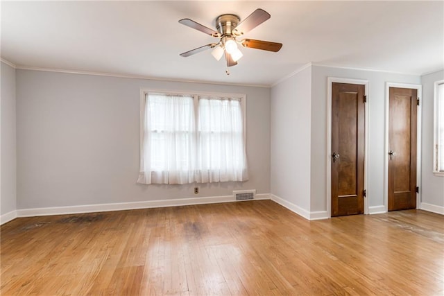 6645 Cherry St, Kansas City, MO 64131 - spare room with a ceiling fan, light wood-style floors, and ornamental molding