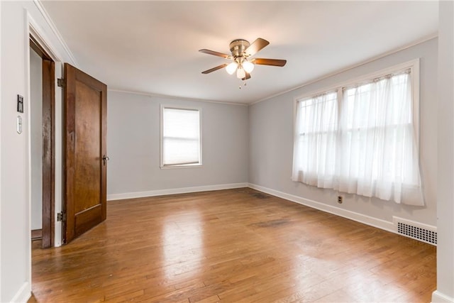 6645 Cherry St, Kansas City, MO 64131 - empty room with a ceiling fan, light wood-style floors, and ornamental molding