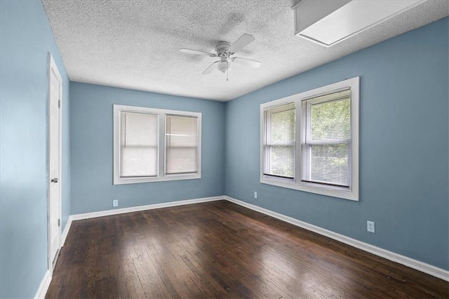 5701 Wabash Ave, Kansas City, MO 64130 - spare room featuring a ceiling fan, hardwood / wood-style flooring, baseboards, attic access, and a textured ceiling