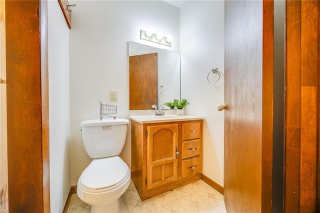 1110 E 1600th Rd, Lawrence, KS 66046 - bathroom featuring vanity, toilet, baseboards, and tile patterned floors