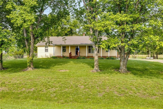 1110 E 1600th Rd, Lawrence, KS 66046 - ranch-style home featuring a front lawn, a chimney, and covered porch