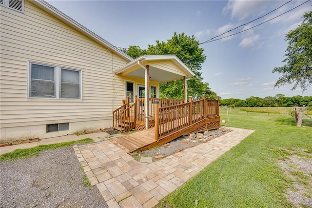 1110 E 1600th Rd, Lawrence, KS 66046 - view of green lawn with a wooden deck and a patio area