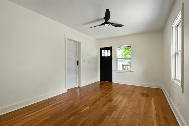 1220 E 24th Ave, Kansas City, MO 64116 - unfurnished room with hardwood / wood-style flooring, ceiling fan, and baseboards