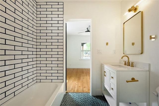 1220 E 24th Ave, Kansas City, MO 64116 - bathroom with vanity and bathing tub / shower combination