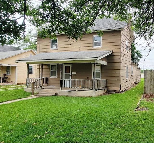 620 N Chestnut St, Iola, KS 66749 - view of front facade featuring roof with shingles and a porch