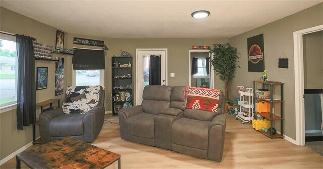 300 Brown Ave, Osawatomie, KS 66064 - living area with light wood-style floors and baseboards