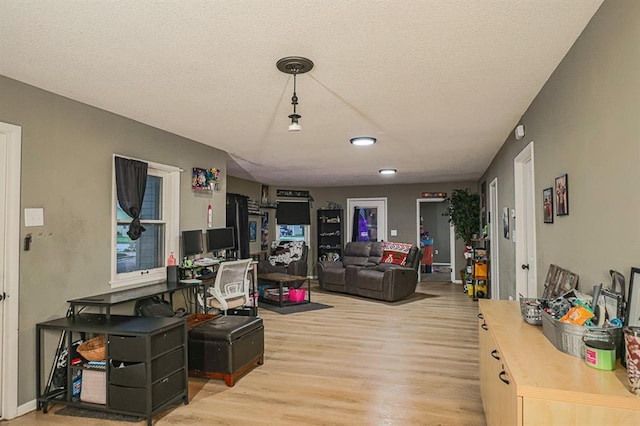 300 Brown Ave, Osawatomie, KS 66064 - living area with light wood-type flooring and a textured ceiling