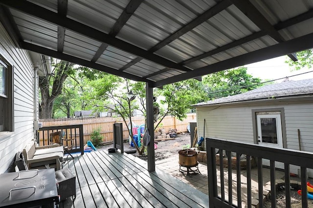 300 Brown Ave, Osawatomie, KS 66064 - wooden deck with a fenced backyard