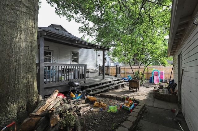 300 Brown Ave, Osawatomie, KS 66064 - wooden deck with a fenced backyard and a patio area