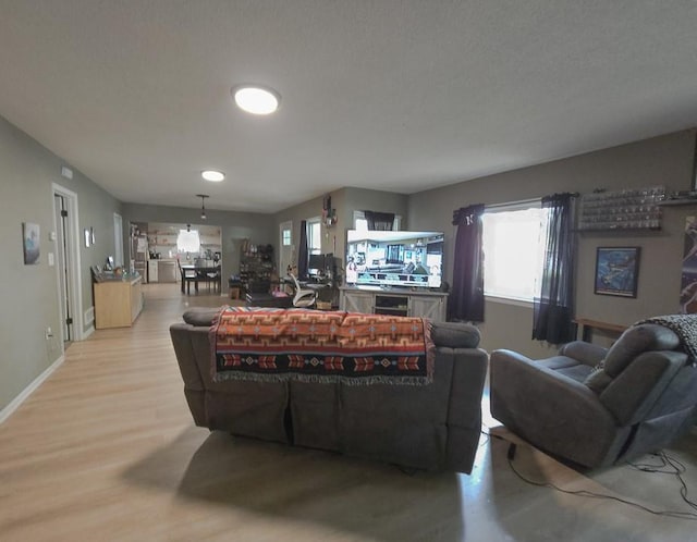 300 Brown Ave, Osawatomie, KS 66064 - living room featuring wood finished floors and baseboards