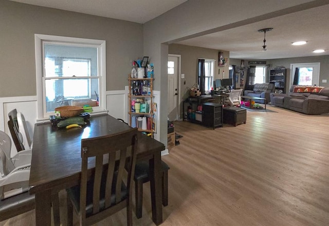 300 Brown Ave, Osawatomie, KS 66064 - dining room with wood finished floors and a wainscoted wall