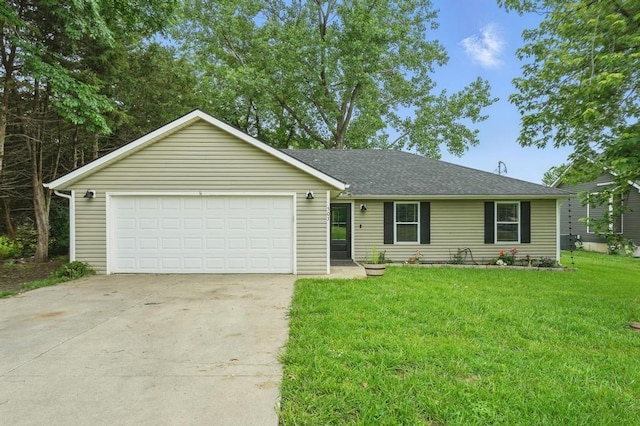503 N Washington St, East Lynne, MO 64743 - ranch-style home with concrete driveway, a front yard, an attached garage, and a shingled roof