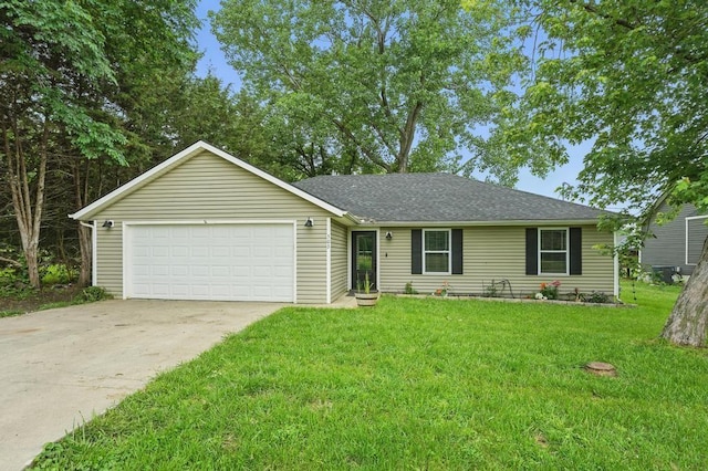 503 N Washington St, East Lynne, MO 64743 - single story home with concrete driveway, an attached garage, a front lawn, and roof with shingles