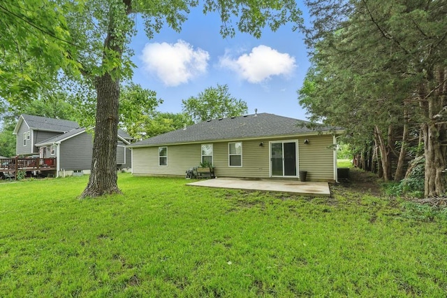 503 N Washington St, East Lynne, MO 64743 - rear view of property with a patio and a yard