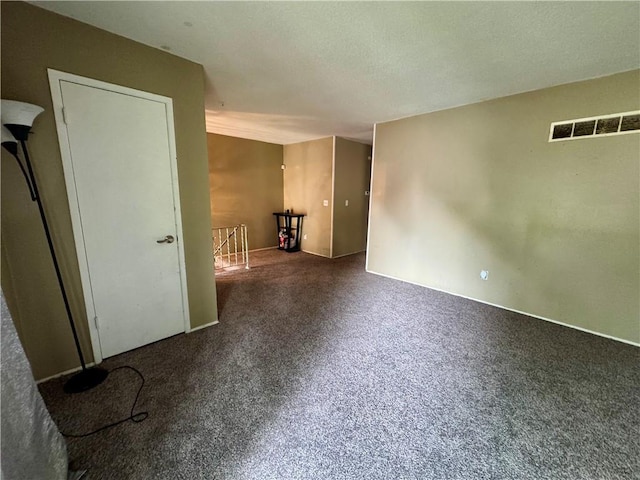 14051 Dunbar Ct, Grandview, MO 64030 - unfurnished room with a textured ceiling