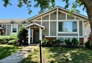 14051 Dunbar Ct, Grandview, MO 64030 - view of front of property with a front lawn