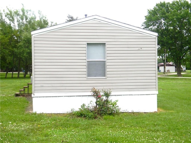 504 N Locust St, Moran, KS 66755 - view of property exterior featuring a lawn