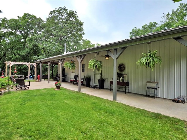 5325 Bryant Bottom Rd, Blackwater, MO 65322 - back of property featuring a ceiling fan, a patio area, a yard, and a playground