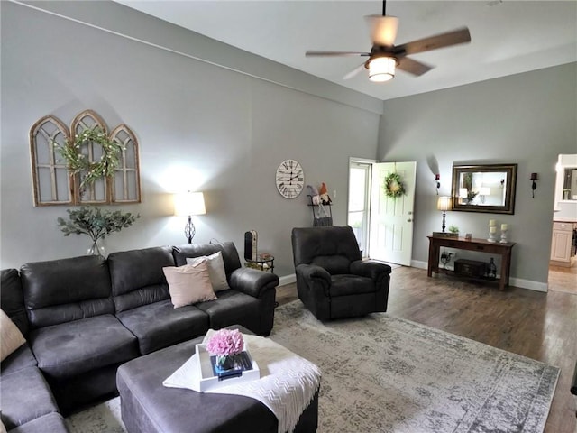 5325 Bryant Bottom Rd, Blackwater, MO 65322 - living area featuring wood finished floors, a ceiling fan, and baseboards