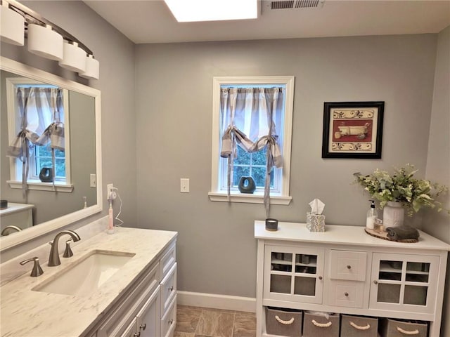 5325 Bryant Bottom Rd, Blackwater, MO 65322 - bathroom with vanity and baseboards