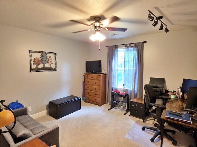 5325 Bryant Bottom Rd, Blackwater, MO 65322 - office area with rail lighting, a ceiling fan, and light carpet