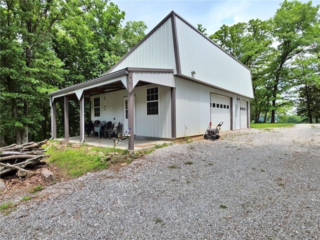 5325 Bryant Bottom Rd, Blackwater, MO 65322 - view of front of home featuring a garage and a patio area