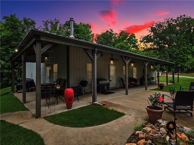 5325 Bryant Bottom Rd, Blackwater, MO 65322 - patio terrace at dusk featuring a patio, ceiling fan, and area for grilling