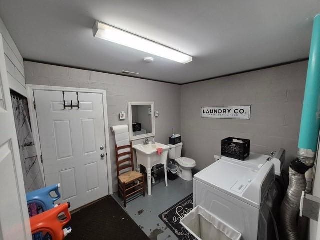 5325 Bryant Bottom Rd, Blackwater, MO 65322 - office area with washer and dryer, concrete flooring, and concrete block wall