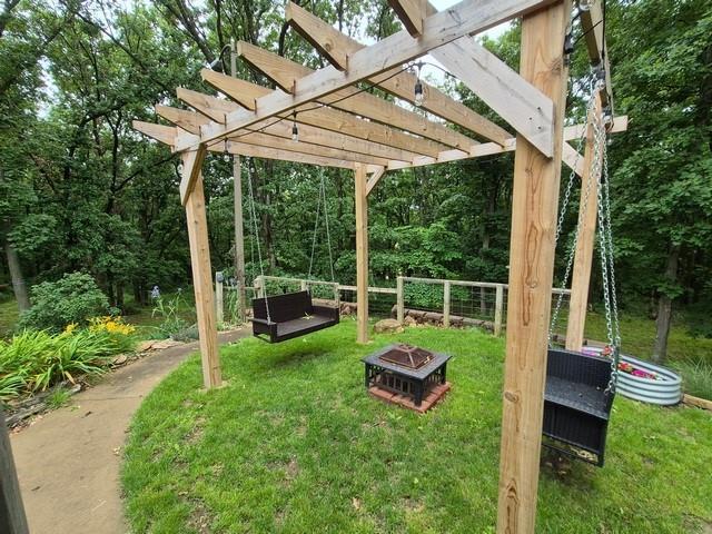 5325 Bryant Bottom Rd, Blackwater, MO 65322 - view of green lawn featuring a fire pit and a pergola