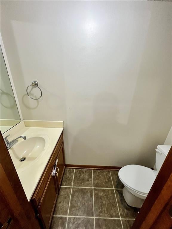 766 Spring Cir, Liberty, MO 64068 - half bath with vanity, toilet, baseboards, and tile patterned floors
