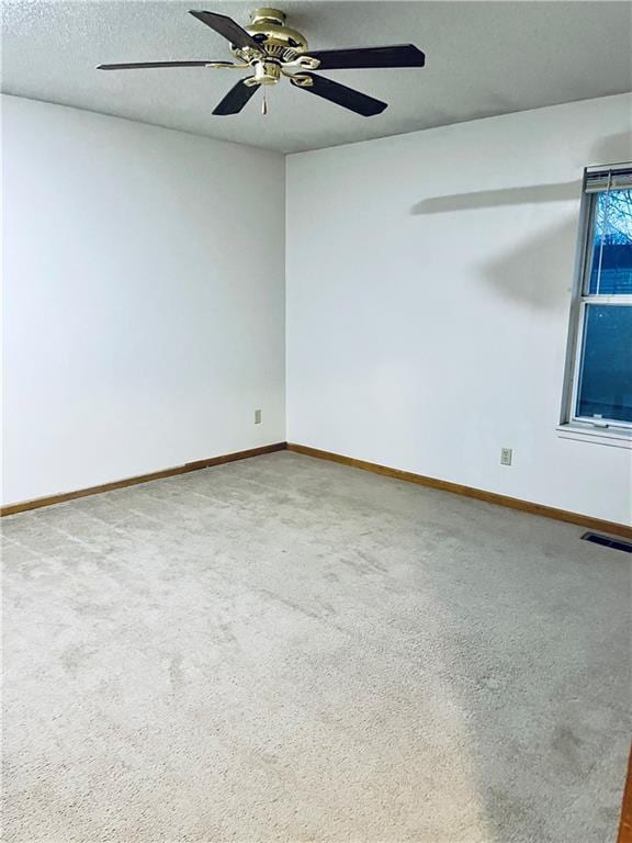 766 Spring Cir, Liberty, MO 64068 - unfurnished room with ceiling fan, carpet flooring, and baseboards