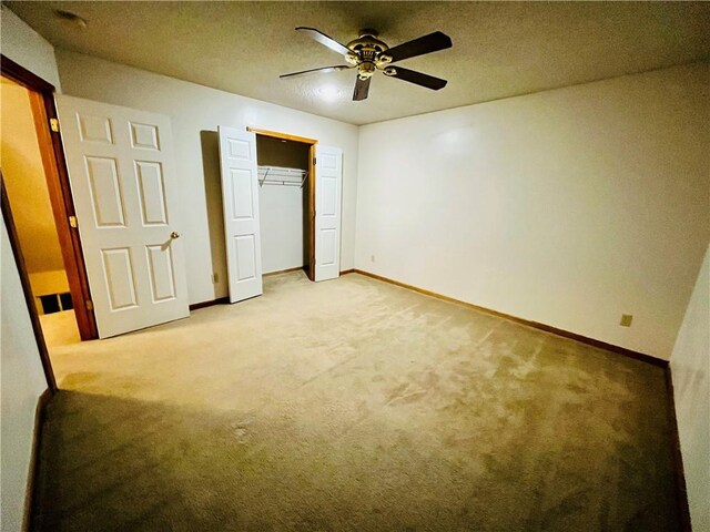 766 Spring Cir, Liberty, MO 64068 - unfurnished bedroom with light carpet, baseboards, and a ceiling fan