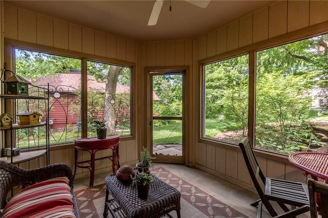 4612 Royal Birkdale Ct, Lawrence, KS 66049 - sunroom with a ceiling fan and wood walls