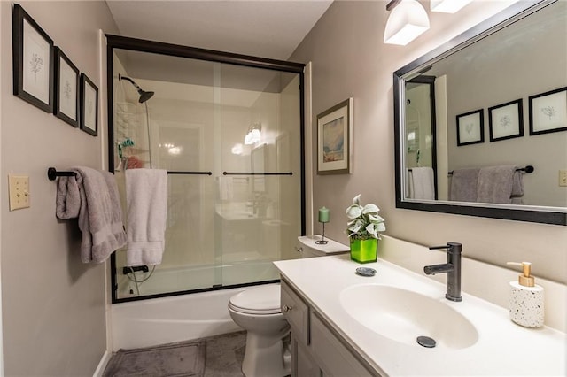 4612 Royal Birkdale Ct, Lawrence, KS 66049 - bathroom with shower / bath combination with glass door, vanity, toilet, and tile patterned floors