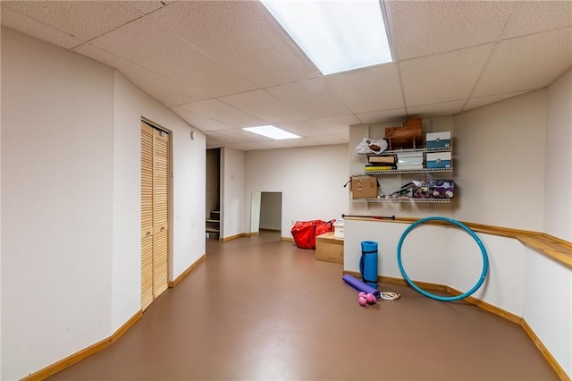 4612 Royal Birkdale Ct, Lawrence, KS 66049 - below grade area featuring a paneled ceiling and baseboards