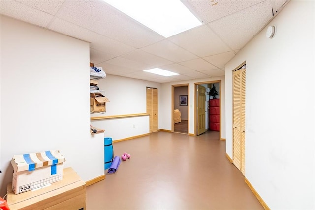 4612 Royal Birkdale Ct, Lawrence, KS 66049 - below grade area with a paneled ceiling and baseboards