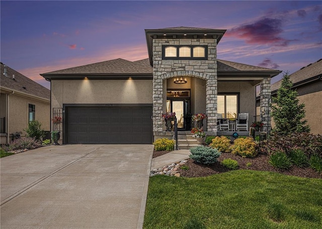 15278 W 173rd St, Olathe, KS 66062 - view of front of property with an attached garage, stone siding, stucco siding, a porch, and driveway