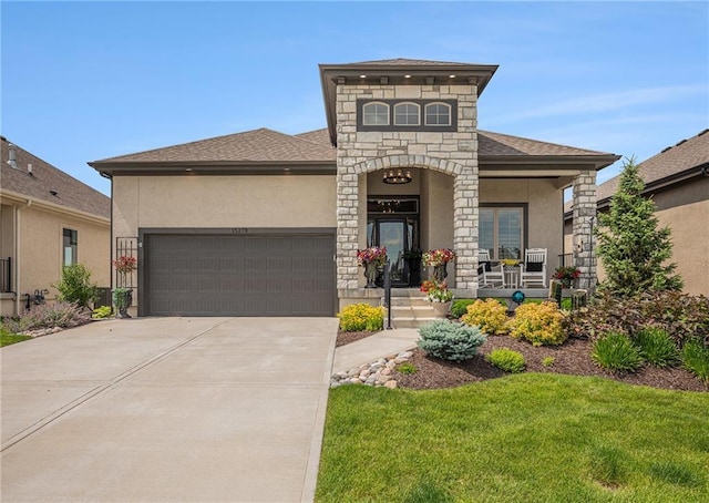 15278 W 173rd St, Olathe, KS 66062 - view of front facade featuring stone siding, an attached garage, stucco siding, driveway, and a porch