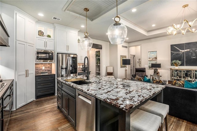 15278 W 173rd St, Olathe, KS 66062 - kitchen with appliances with stainless steel finishes, white cabinetry, dark wood-style floors, open floor plan, and recessed lighting